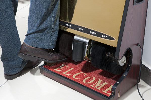 Shoe polishing machine in the lobby and on each floor